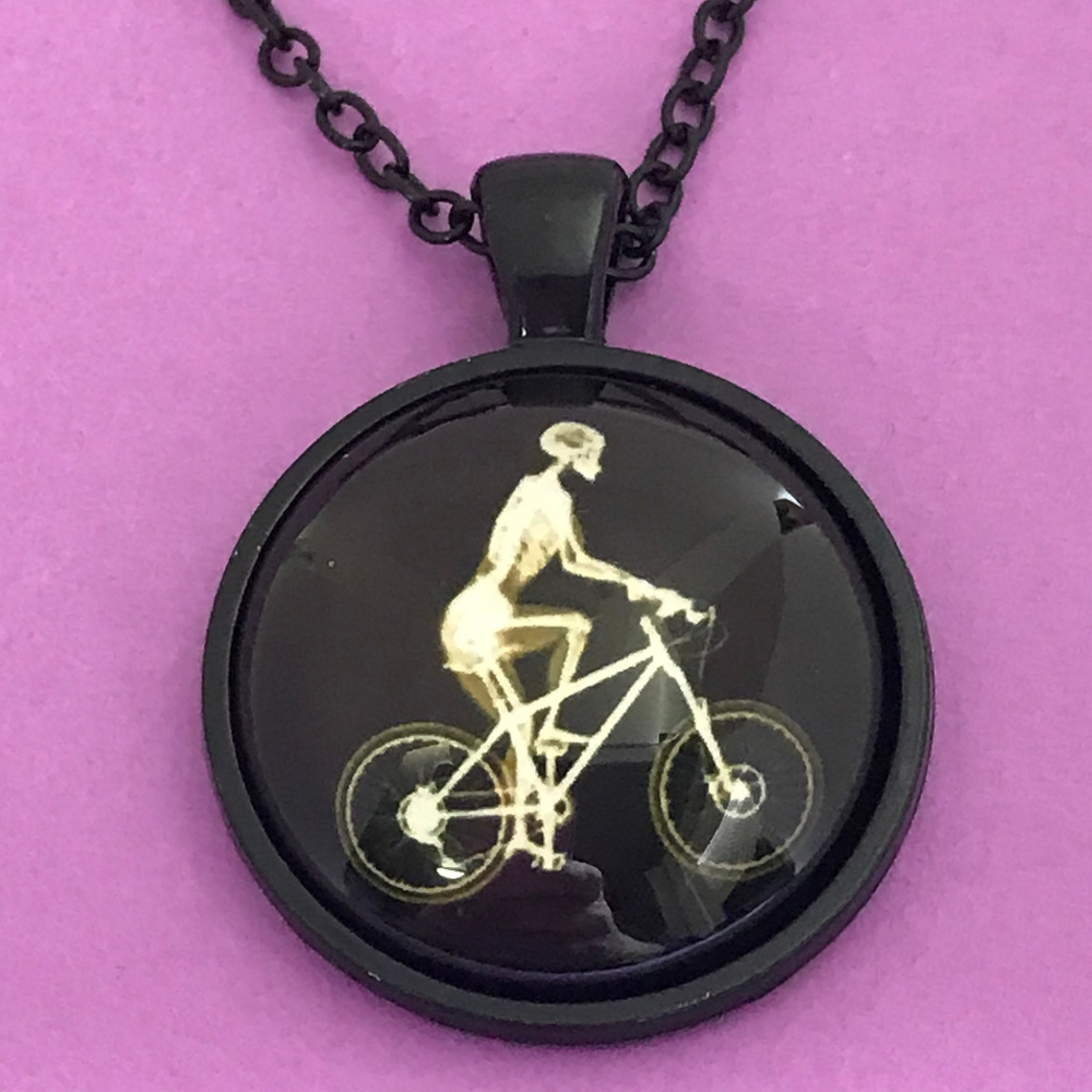 Skeleton Riding Bike Glow in the Dark Necklace